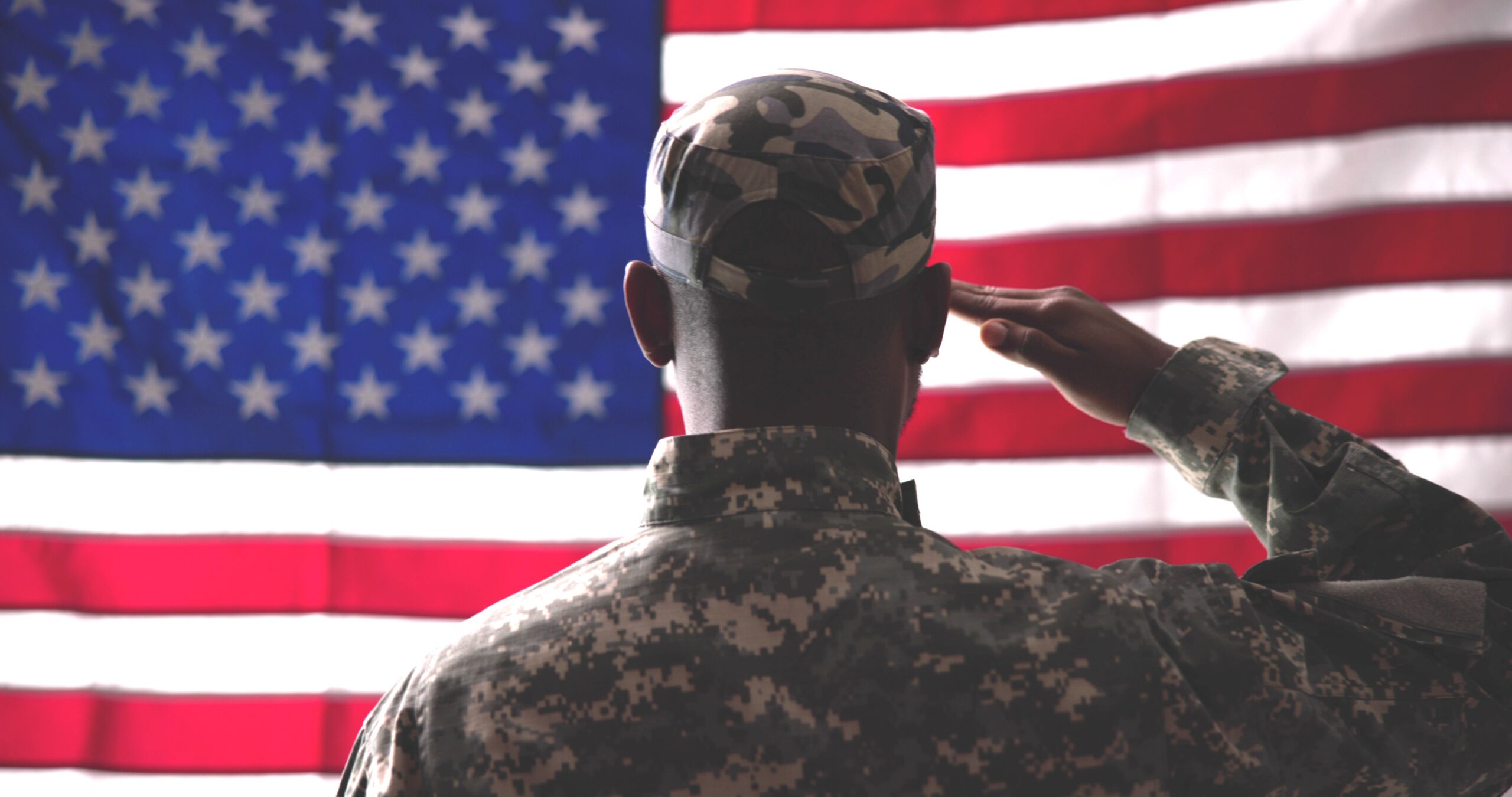 soldier saluting the flag