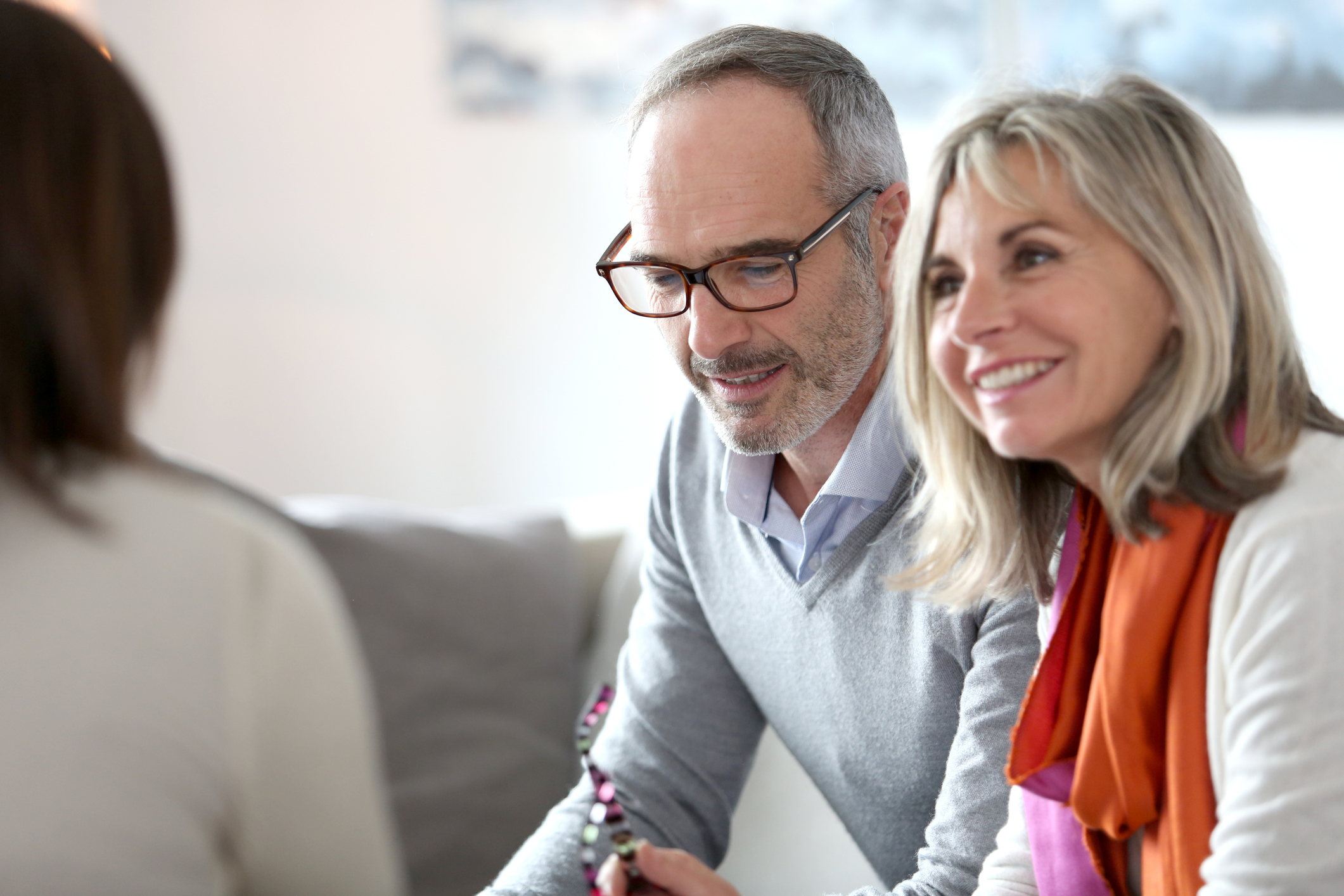 senior couple talking with estate planning attorney